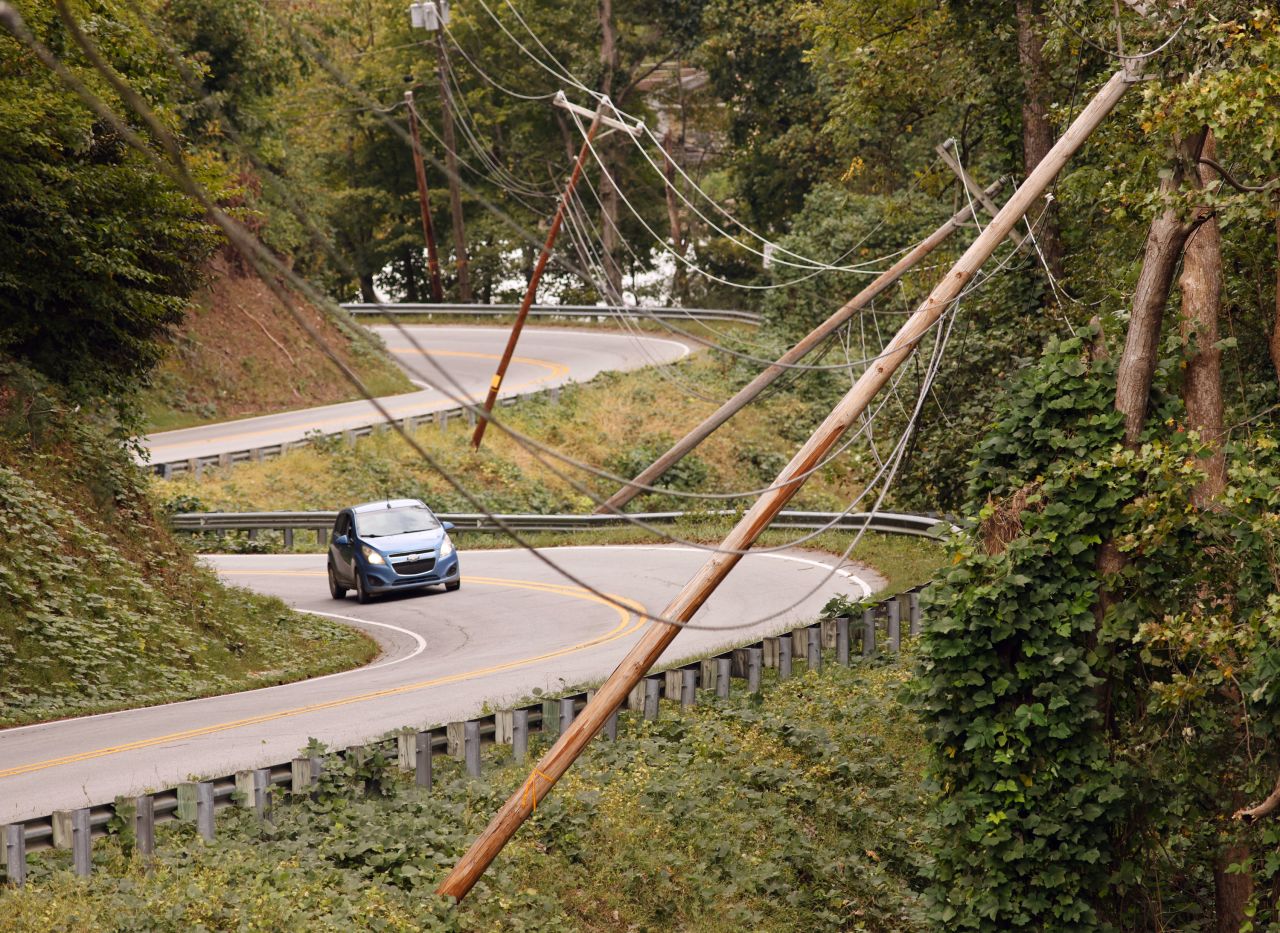 Power line poles lean after Hurricane Helene caused widespread damage to infrastructure in Lake Lure, North Carolina, on Tuesday.