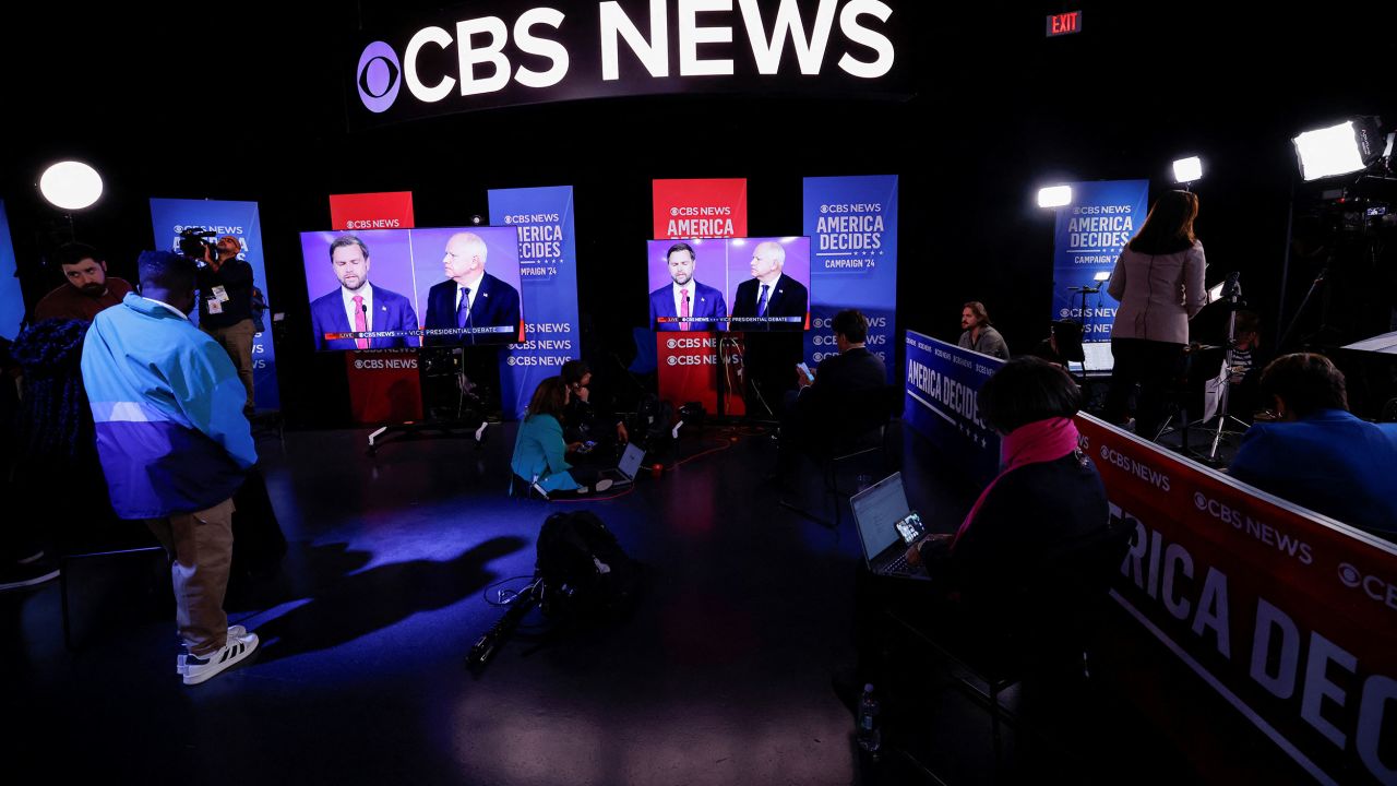 Screens shows Republican vice presidential nominee U.S. Senator JD Vance (R-OH) and Democratic vice presidential nominee Minnesota Governor Tim Walz attending a debate hosted by CBS in New York, U.S., October 1, 2024. REUTERS/Brendan McDermid