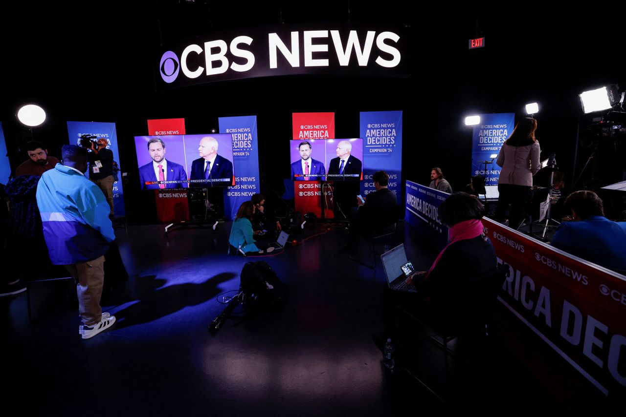 People watch the debate from a nearby "spin room" in New York. The spin room is where supporters of each candidate put their “spin” on the debate as they talk with journalists.