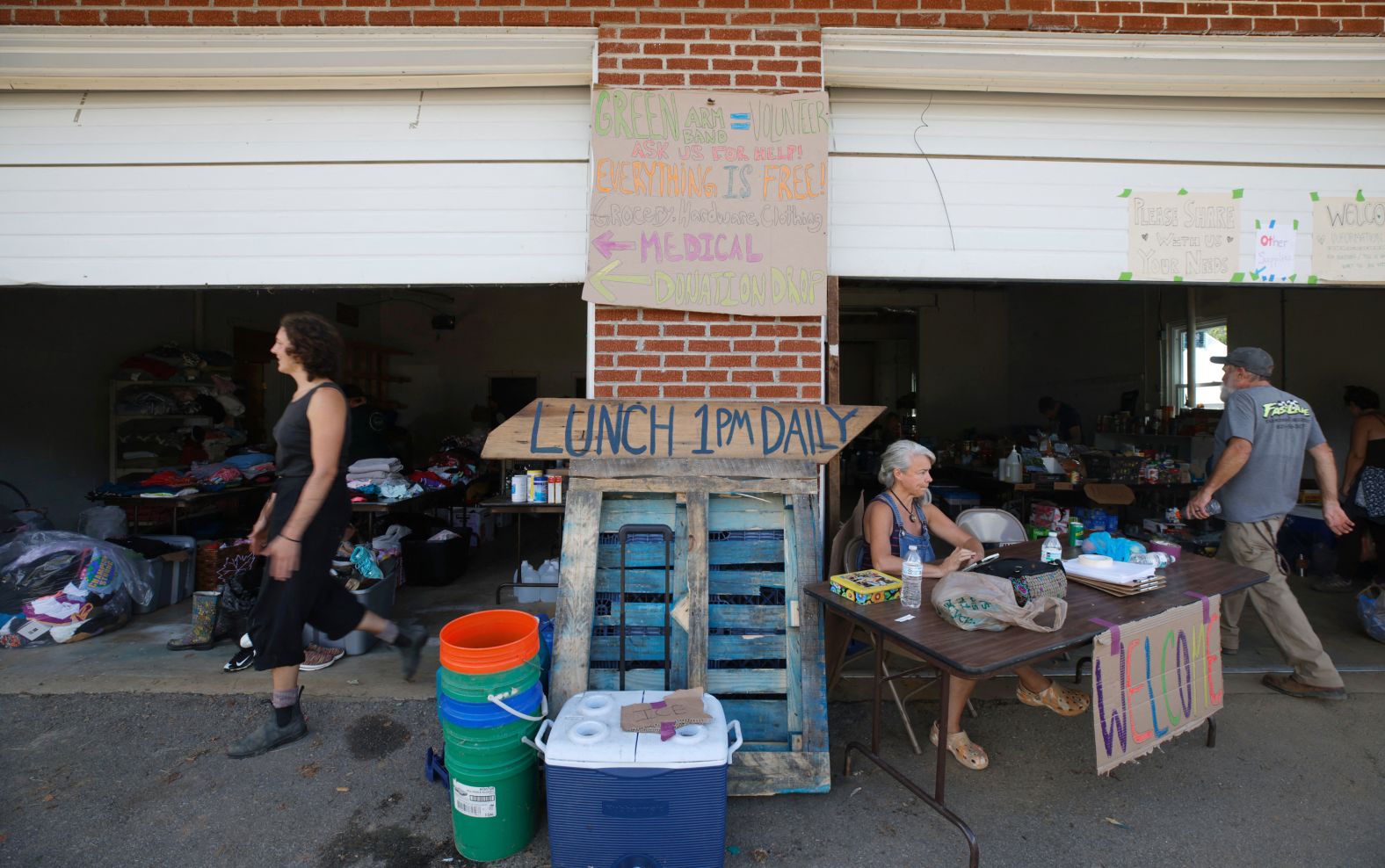 People help run a volunteer local community care center in Barnardsville, North Carolina, on Wednesday.