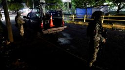 Soldiers stand guard outside a hospital where injured migrants were taken after Mexican soldiers shot a group of 33 migrants in Tapachula, Mexico. October 2, 2024. REUTERS/Jose Torres - RC2HCAAVY400