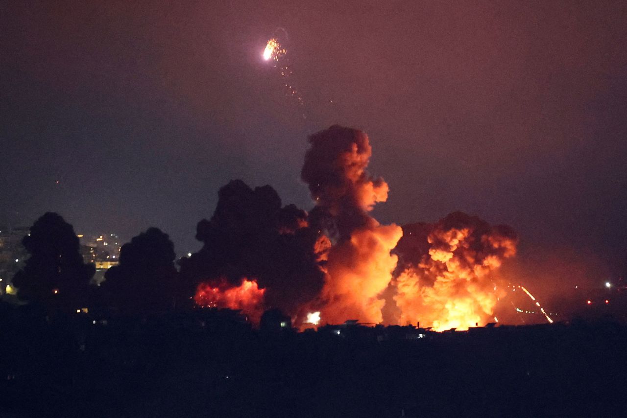 Smoke rises following an explosion over Beirut's southern suburbs after a strike, as seen from Sin El Fil, Lebanon, on Thursday.