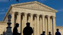 People are seen outside the Supreme Court building in Washington, DC, on June 29.