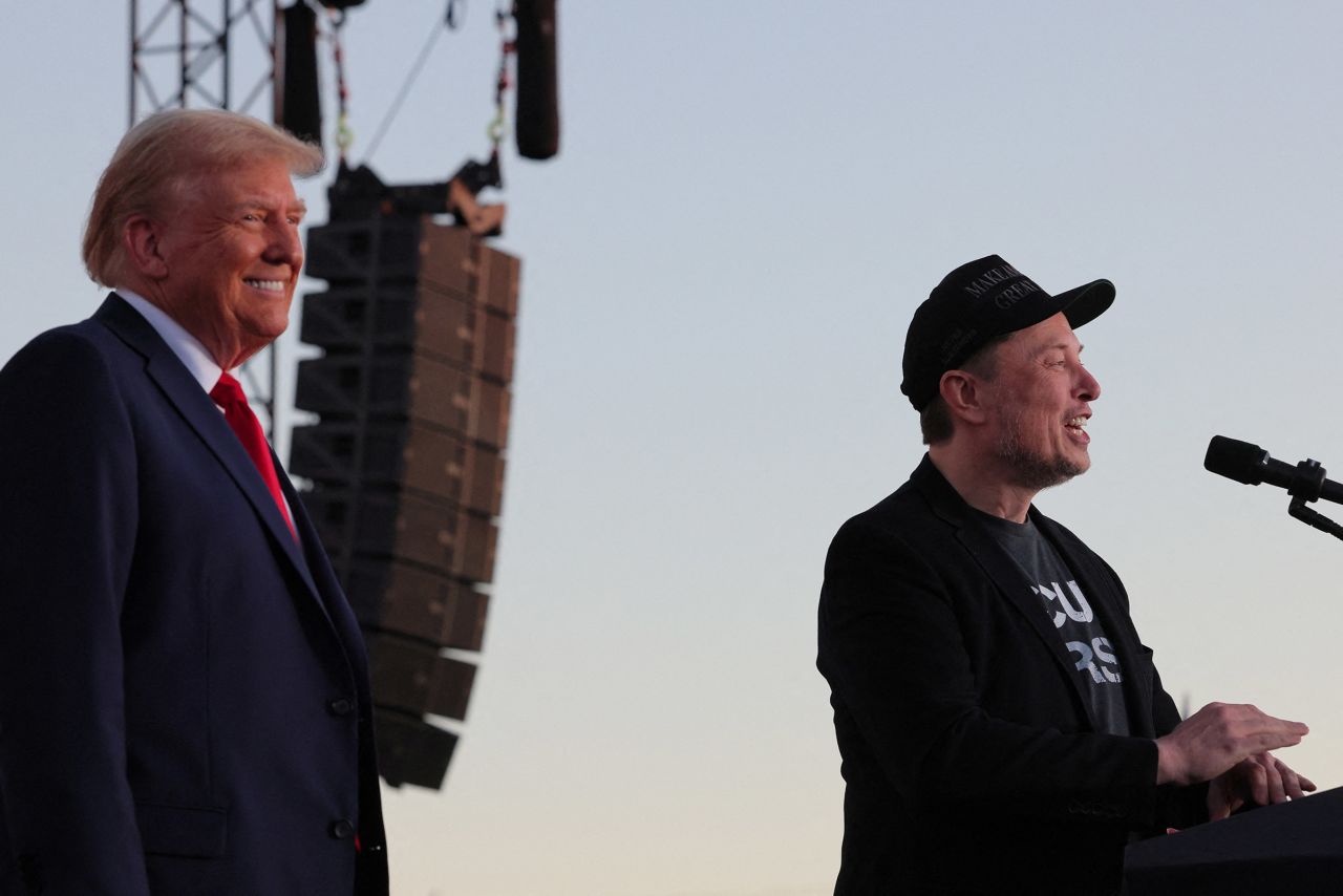 Tesla CEO and X owner Elon Musk speaks as Republican presidential nominee, former President Donald Trump looks on during a campaign rally in Butler, Pennsylvania, on October 5.