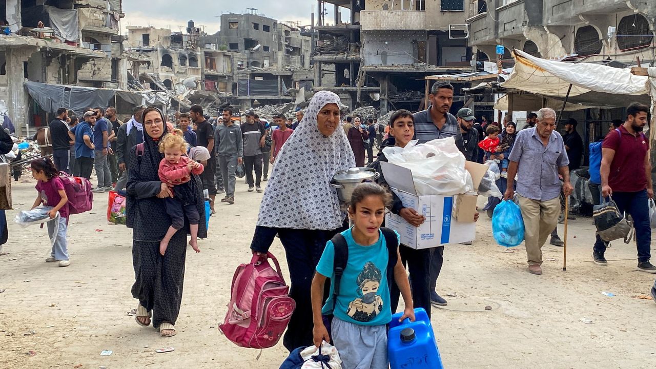 Displaced Palestinians flee following an Israeli evacuation order in Jabalia, Gaza, on October 6.