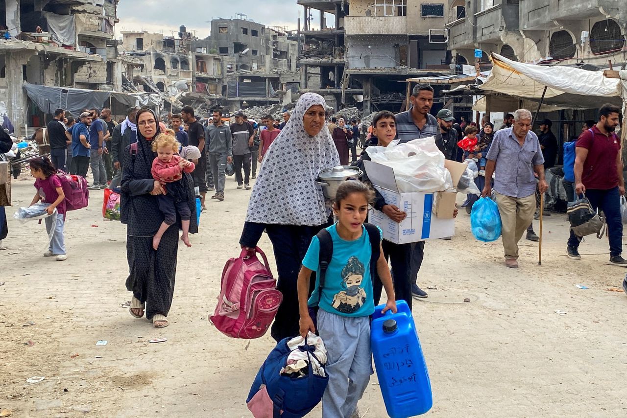 Displaced Palestinians flee following an Israeli evacuation order in Jabalia, Gaza, on October 6.