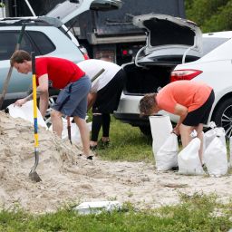 People prepare sandbags, as they are distributed to Pinellas County residents before the expected arrival of Tropical Storm Milton, in Seminole, Florida, U.S. October 6, 2024.