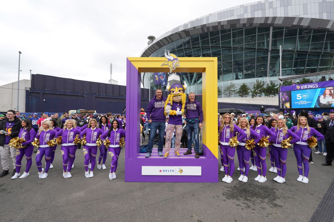 Oct. 6, 2024; London, United Kingdom; Minnesota Vikings fans pose with mascot VIktor and cheerleaders before the NFL game in London at Tottenham Hotspur Stadium. Mandatory attribution: Kirby Lee-Imagn Images