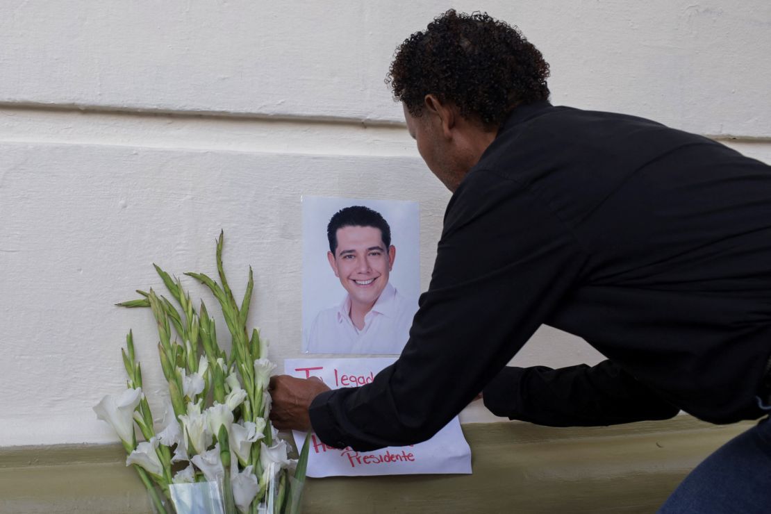 A mourner pays respects to Alejandro Arcos in Chilpancingo, Mexico, on October 7.