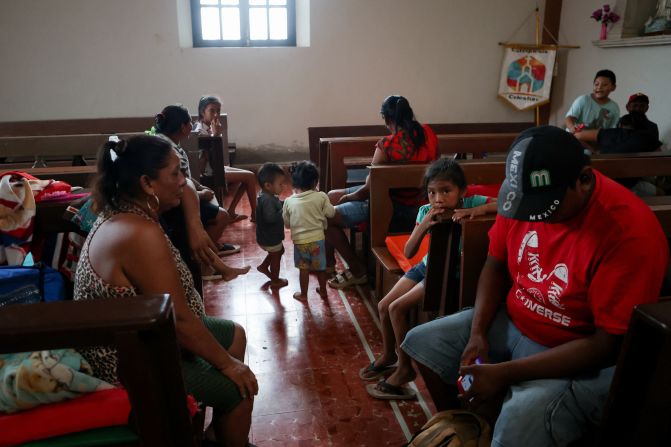 People take shelter in a church after Hurricane Milton brought heavy rain to Mexico's Yucatan Peninsula on its way to Florida, in Celestun, Mexico, on Tuesday.