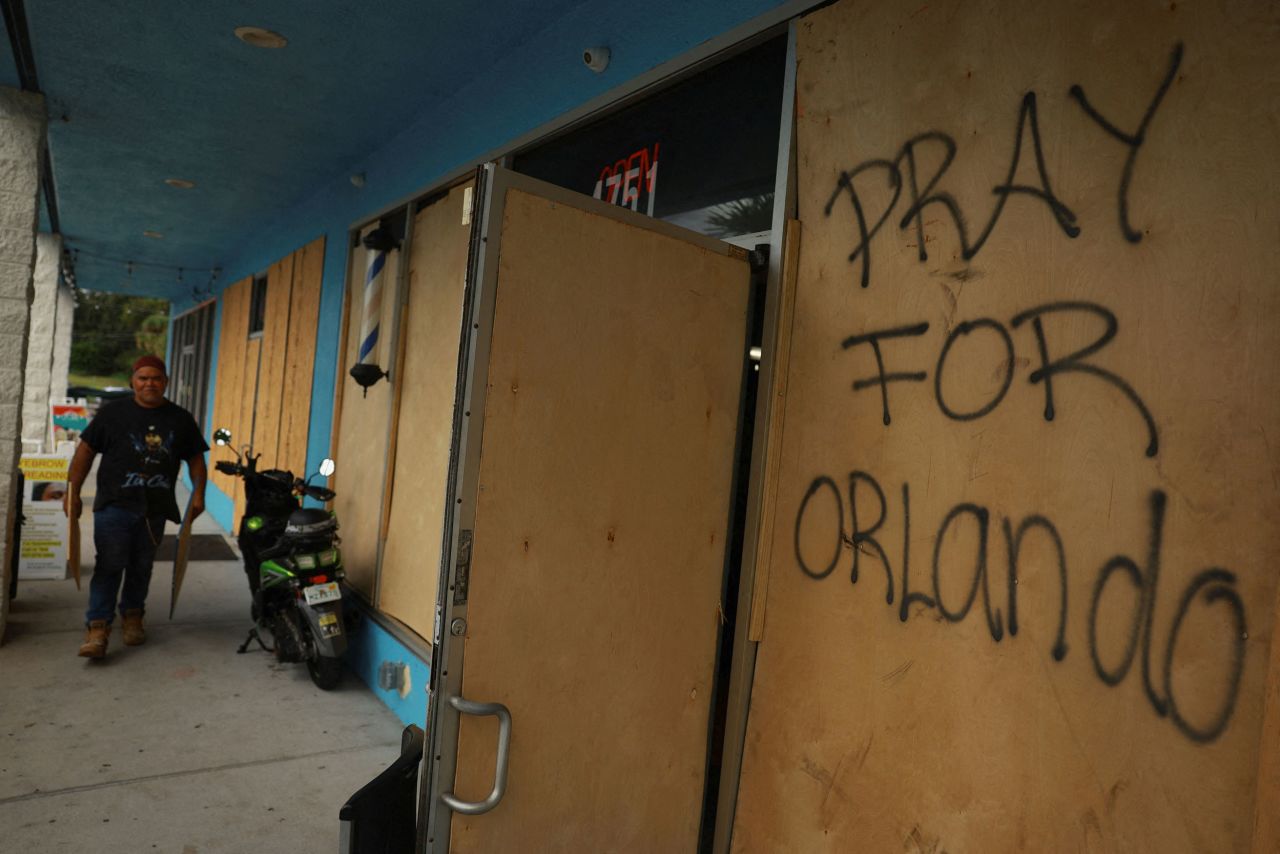 A shop is boarded up in Orlando on October 8.