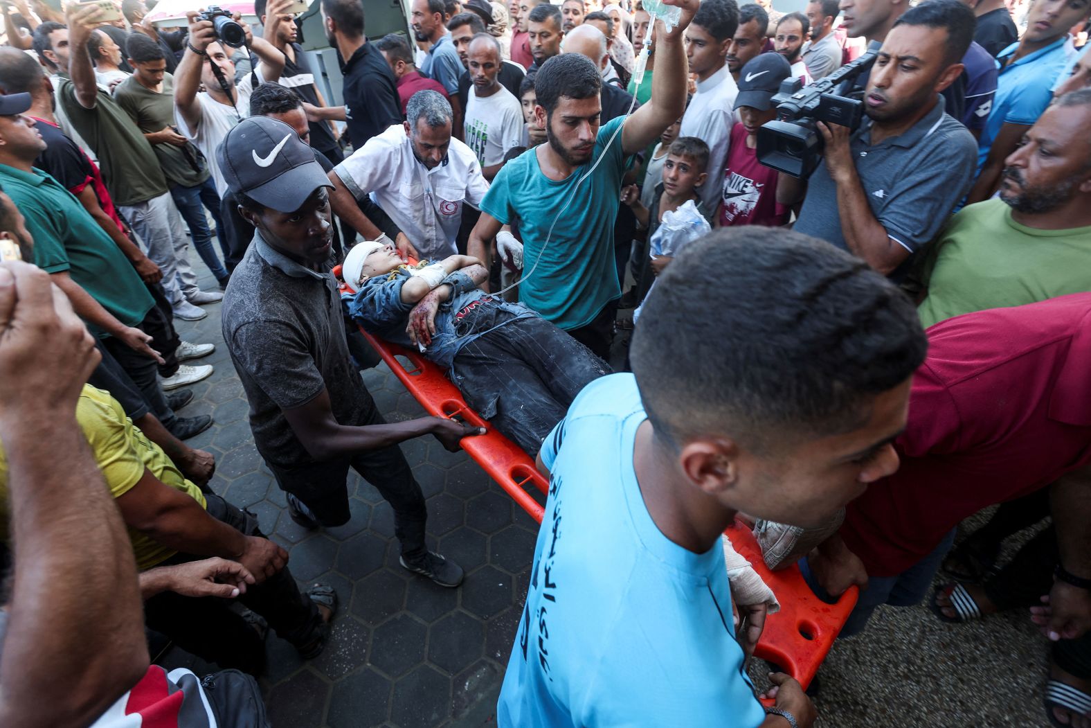A wounded Palestinian is carried to the Al-Aqsa Martyrs Hospital in Deir Al-Balah, Gaza, after an Israeli airstrike on Thursday, October 10. <a href="index.php?page=&url=https%3A%2F%2Fwww.cnn.com%2F2024%2F10%2F10%2Fmiddleeast%2Fisraeli-strike-kills-at-least-28-palestinians-at-school-gaza-intl%2Findex.html">The airstrike</a> killed at least 28 people wounded dozens more sheltering at a school turned shelter, the Palestine Red Crescent Society said. The Israeli military said it struck “terrorists who were operating inside a command and control center” at the school compound, saying “numerous steps” were taken to protect civilians. CNN cannot independently verify the claim.