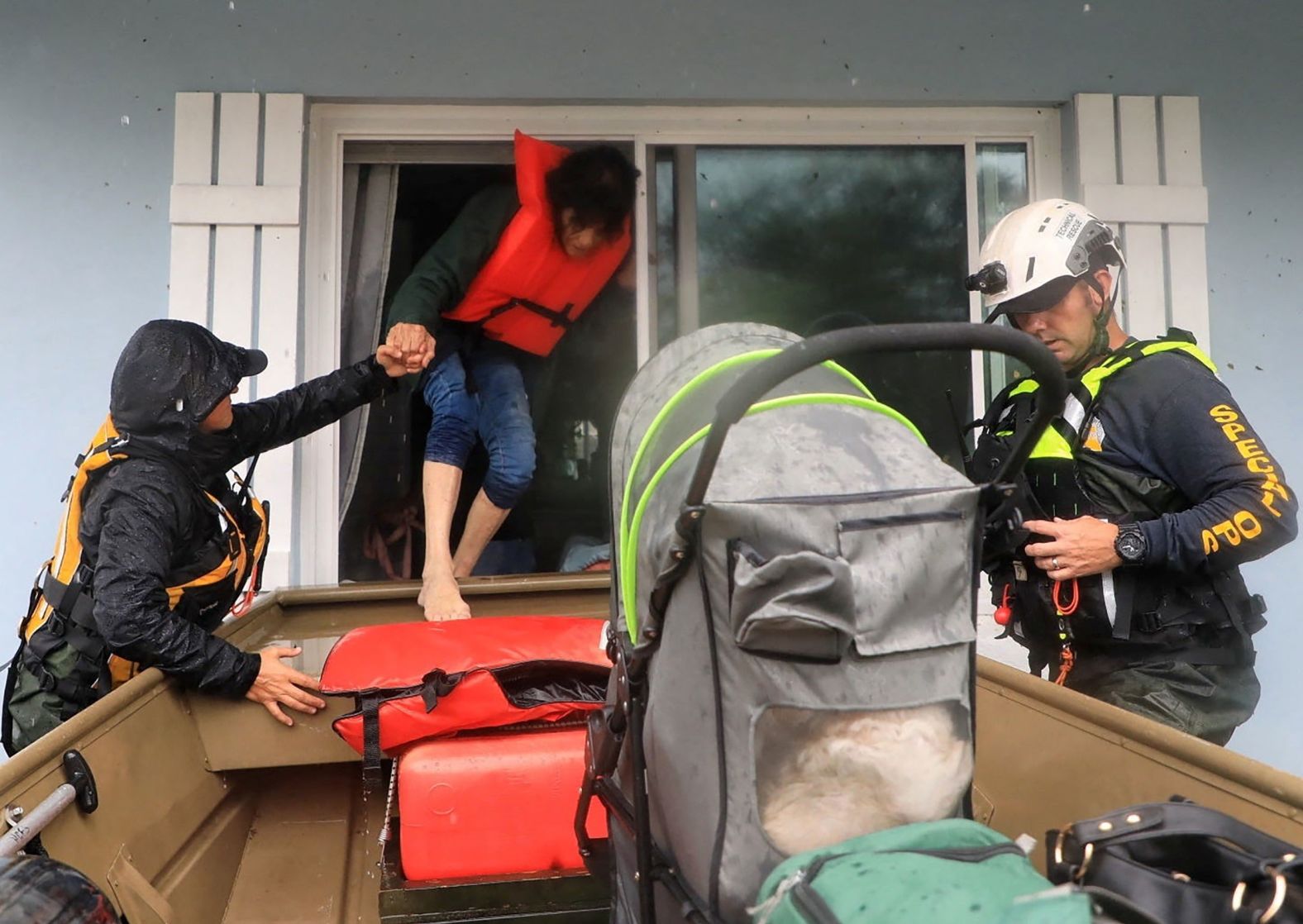 Members of the Volusia Sheriff's Office rescue residents from a flooded area of South Daytona, Florida, on Thursday.