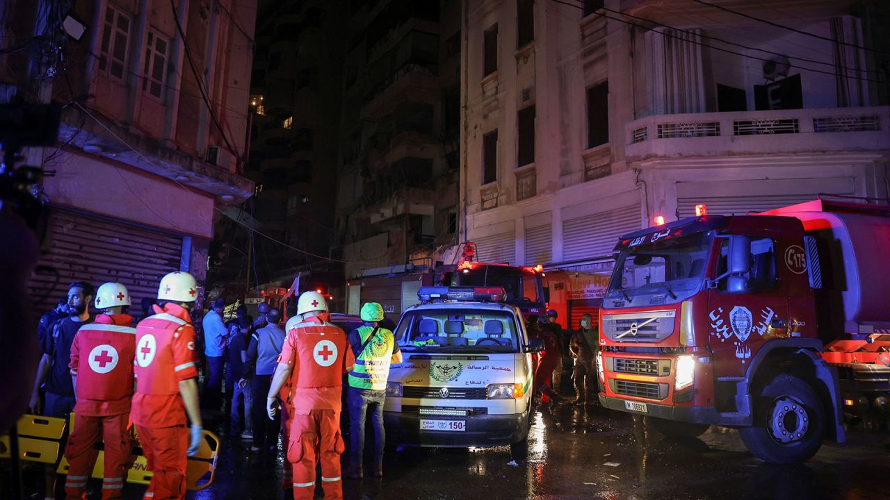 Members of the Red Cross work at the site of an Israeli air strike in Ras Al- Nabaa, in Beirut, Lebanon, on Thursday,  October 10.