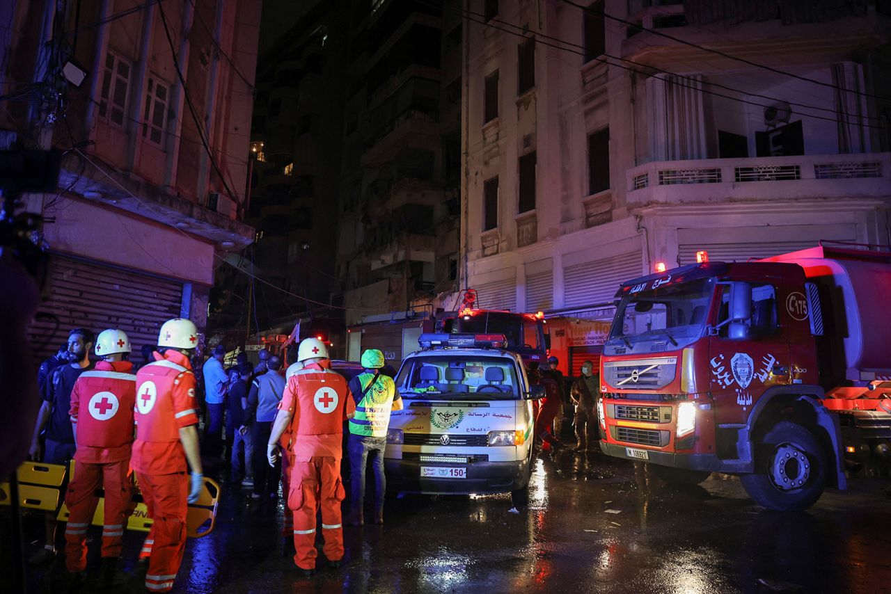 Members of the Red Cross work at the site of an Israeli air strike in Ras Al- Nabaa, in Beirut, Lebanon, on Thursday,  October 10.