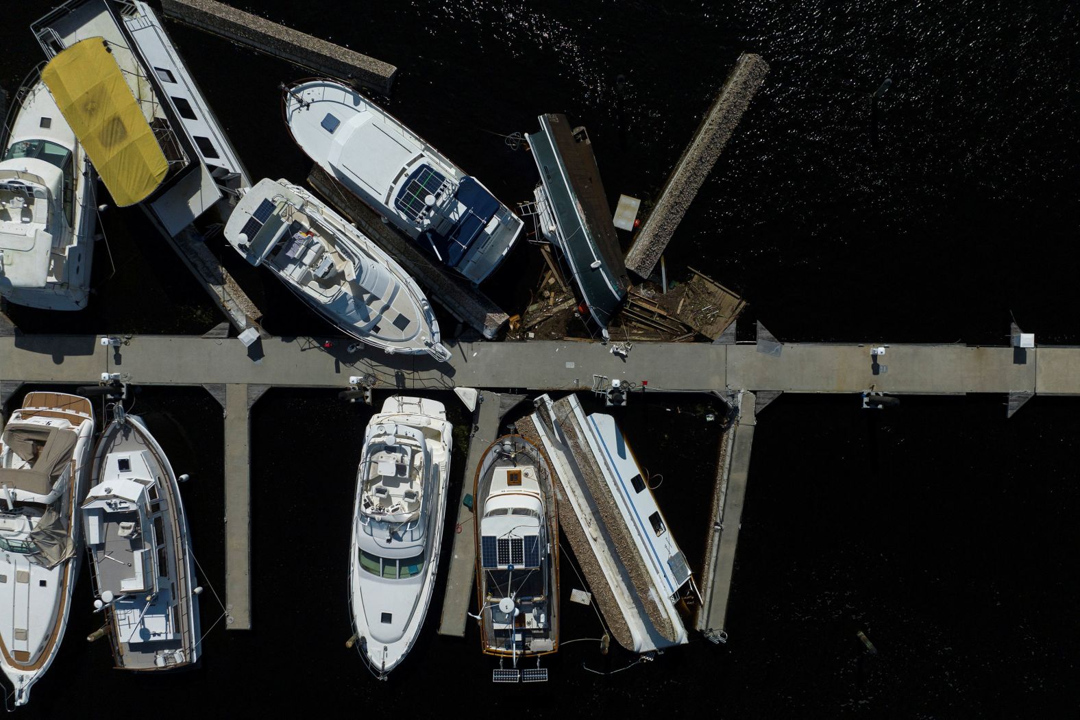 Boats are piled up on a pier after they were washed ashore when Milton passed through Punta Gorda, Florida, on Thursday.