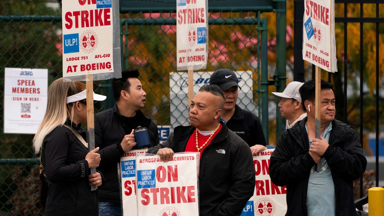 Boeing factory workers and supporters gather on a picket line near the entrance to a Boeing production facility in Renton, Washington, on October 11, 2024.