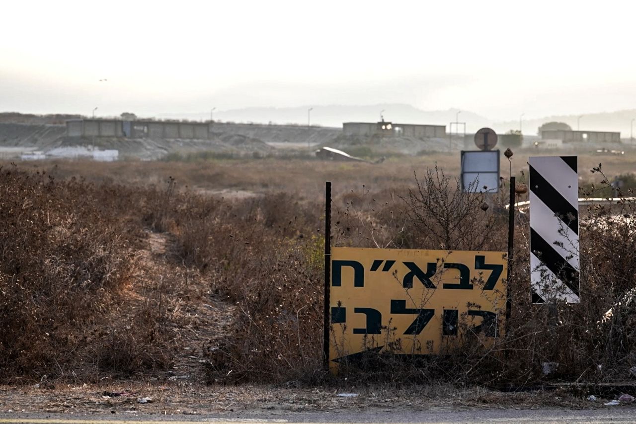 A Hebrew sign shows the direction to a military base, the scene of where a drone from Lebanon attacked Israel, in Binyamina, Israel, on October 14.