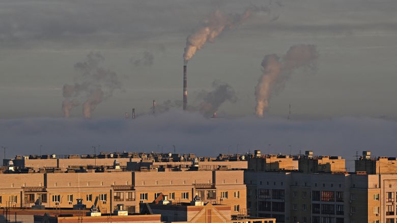 Steam rises from the chimneys of a thermal power plant and an oil refinery in Omsk, Russia, in October 2024.