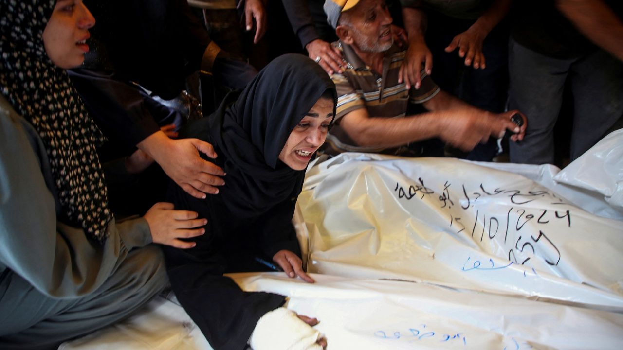 Relatives react next to the bodies of Palestinians who were killed in an Israeli strike in Khan Younis, Gaza, on October 15.