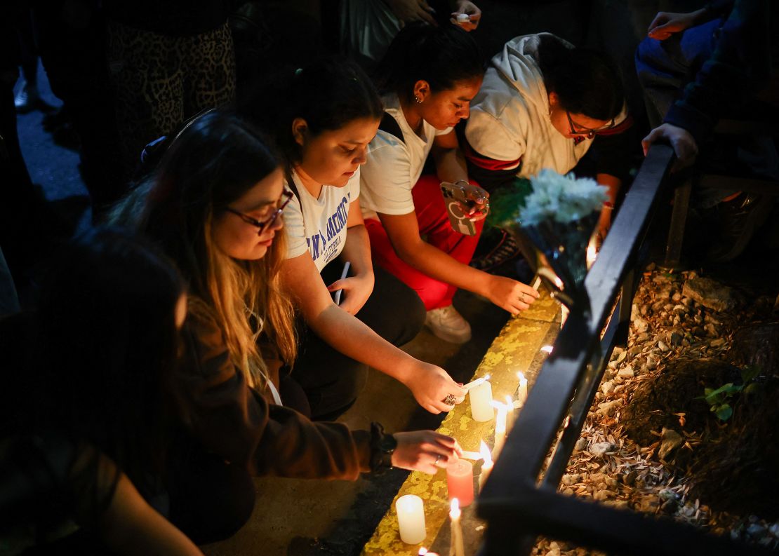 Fans place candles outside the hotel where former One Direction member Liam Payne was found dead in Buenos Aires, Argentina, on Wednesday.