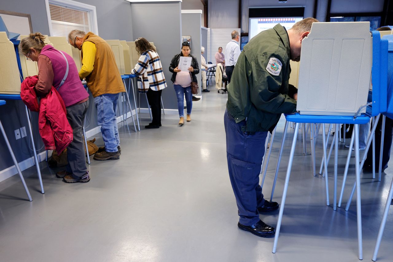 Voters mark their ballots on the first day of early in-person voting in Marion, North Carolina, on Thursday.