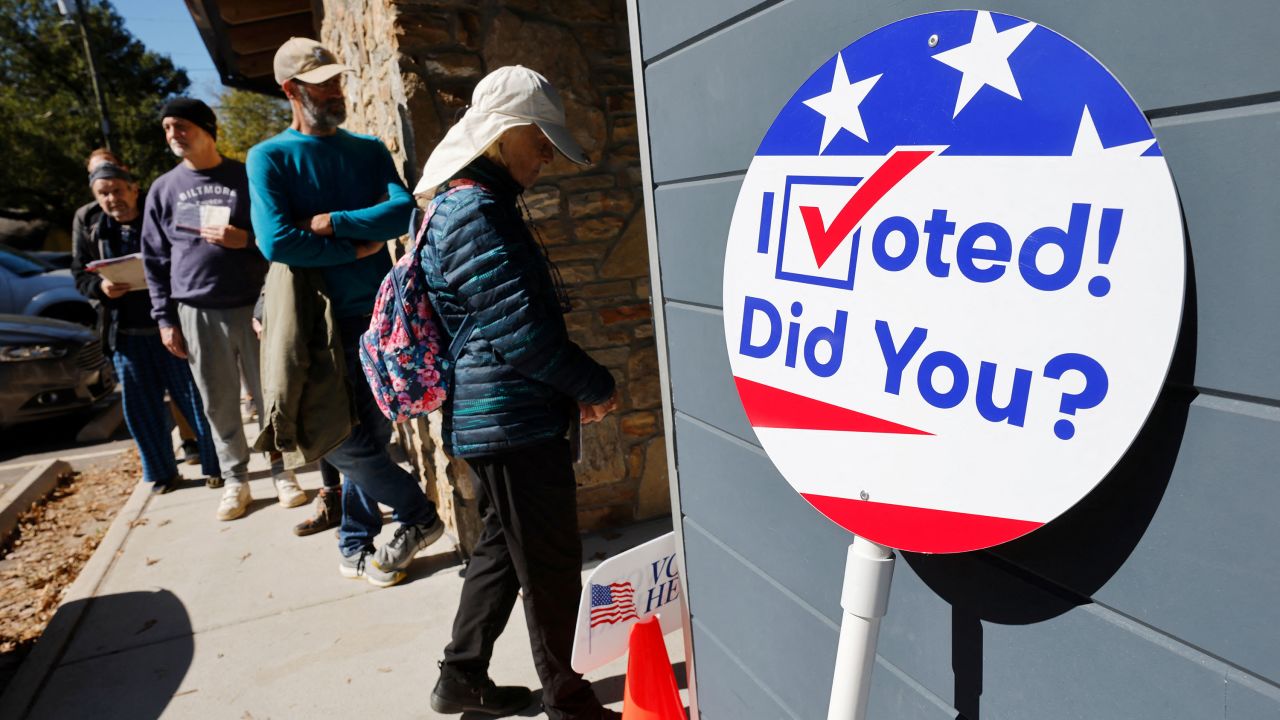 Local residents line up to enter a polling site on the first day of early in-person voting in a region still severely impacted by the storm, in Asheville, North Carolina, U.S. October 17, 2024. REUTERS/Jonathan Drake