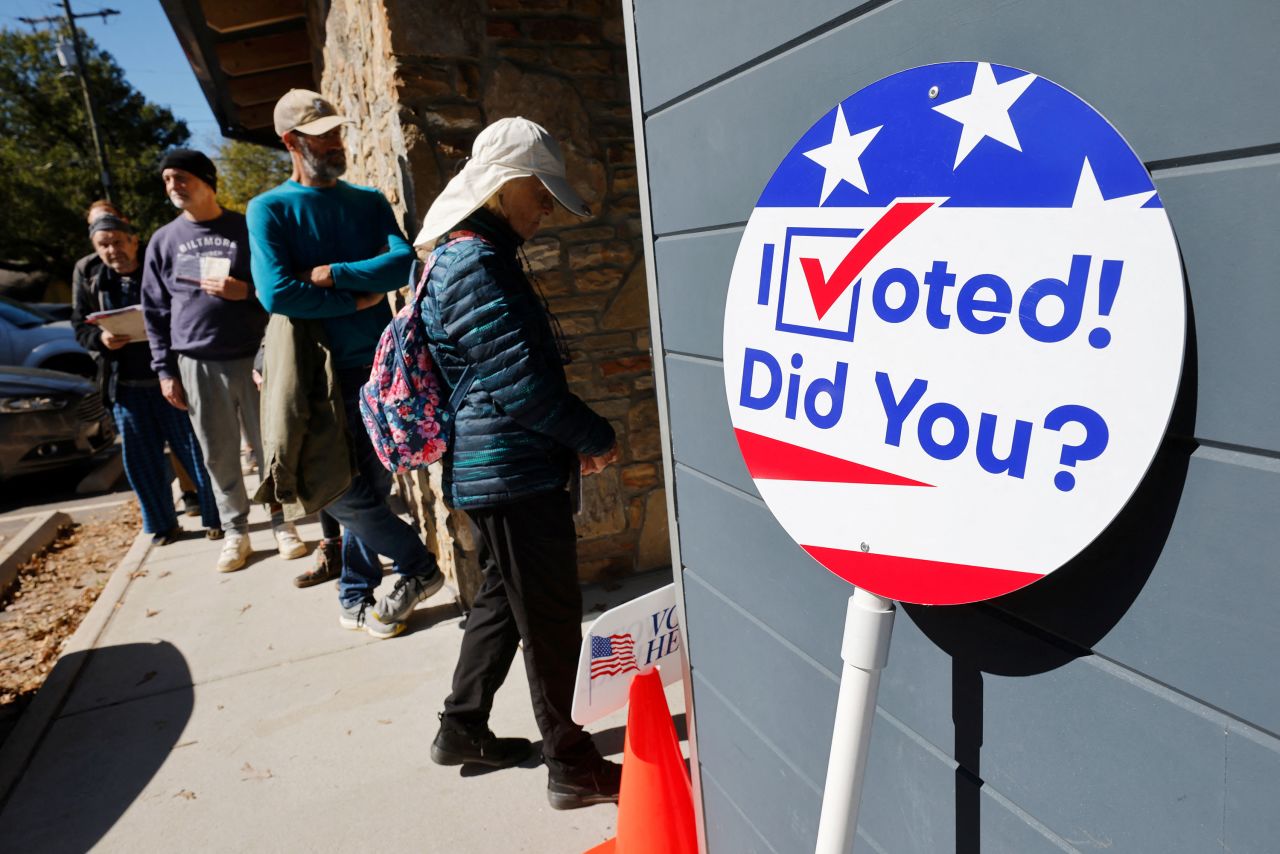 Local residents line up to enter a polling site on the first day of early in-person voting in Asheville, North Carolina, on October 17.