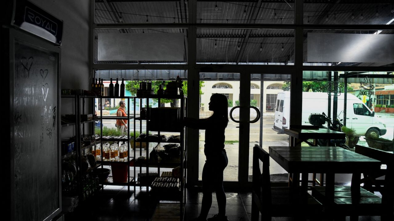 A woman works in a restaurant during a blackout in Havana, Cuba, on Thursday.