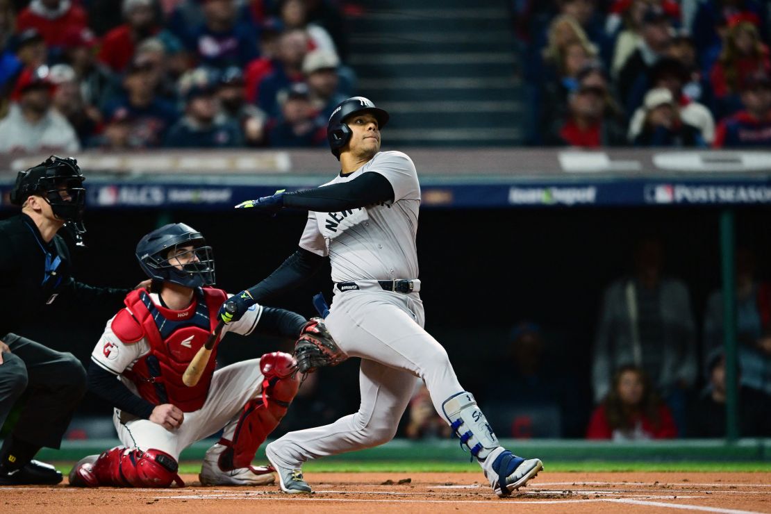 October 18, 2024; Cleveland, Ohio, USA; New York Yankees outfielder Juan Soto (22) hits a two-run home run against the Cleveland Guardians in the first inning during game four of the ALCS for the 2024 MLB playoffs at Progressive Field. Mandatory credit: David Dermer-Imagn images