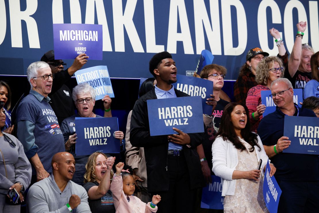 Supporters hold signs during a campaign rally for Democratic presidential candidate U.S. Vice President Kamala Harris in Waterford township in Oakland County, Michigan, U.S., October 18, 2024. REUTERS/Rebecca Cook