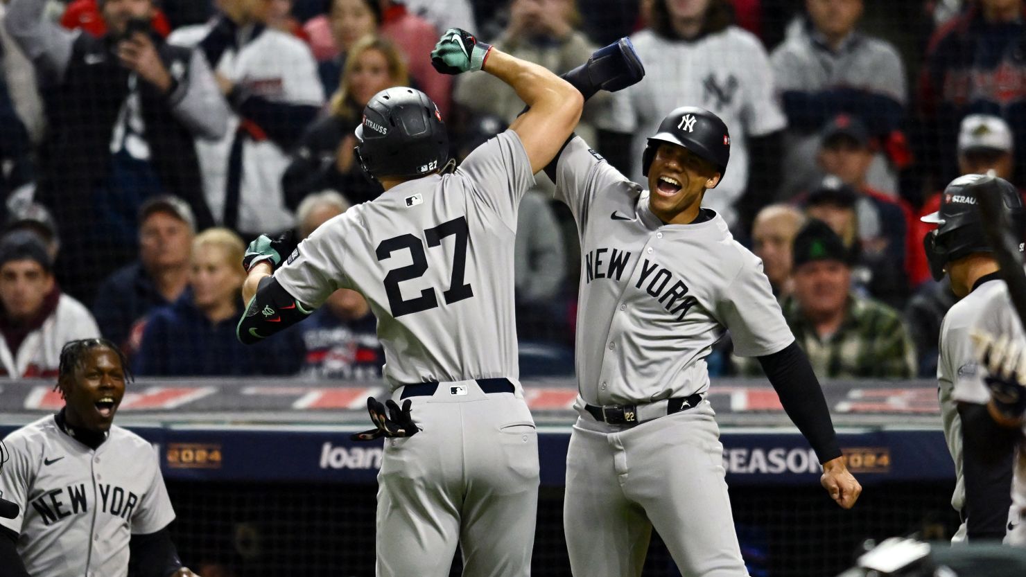 Oct 18, 2024; Cleveland, Ohio, USA; New York Yankees designated hitter Giancarlo Stanton (27) celebrates with outfielder Juan Soto (22) after hitting a three run home run in the sixth inning against the Cleveland Guardians during game four of the ALCS for the 2024 MLB playoffs at Progressive Field. Mandatory Credit: Ken Blaze-Imagn Images