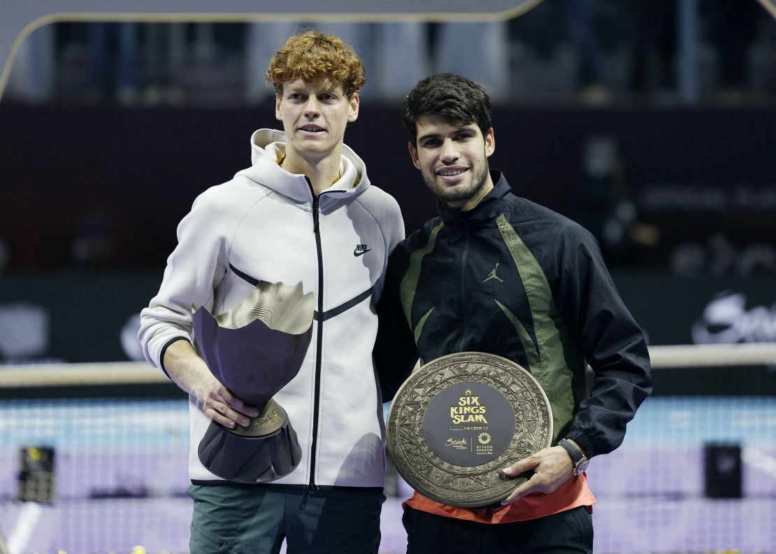 Italy's Jannik Sinner posses with the trophy after winning the Six Kings Slam over Carlos Alcaraz.