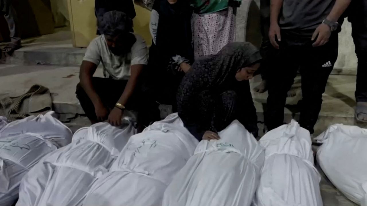 Mourners react next to the bodies of Palestinians killed in Israeli strikes at Kamal Adwan hospital in  northern Gaza on Sunday.