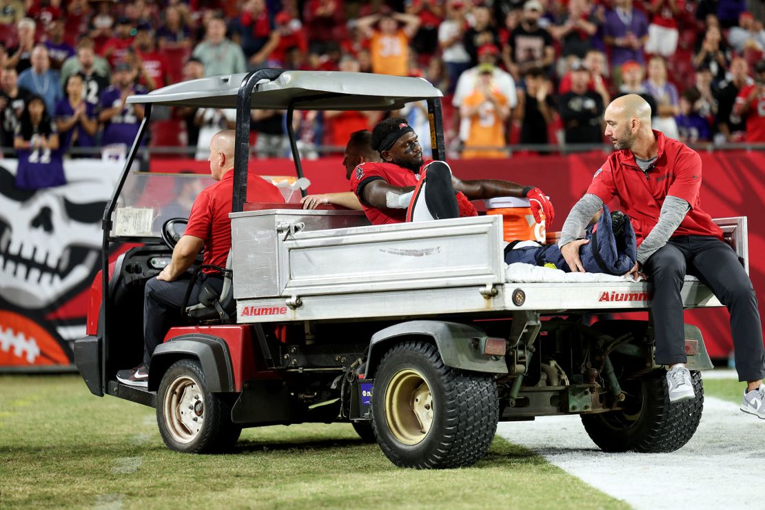 Godwin departs the field on a cart after an ankle injury.