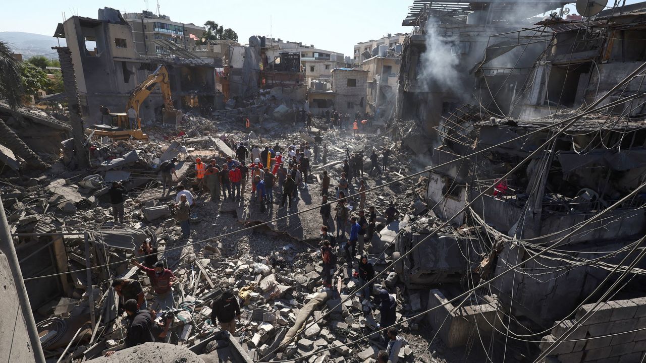 Rescuers search for survivors at the site of an Israeli strike near Rafik Hariri University Hospital, in Beirut, Lebanon, on October 22.