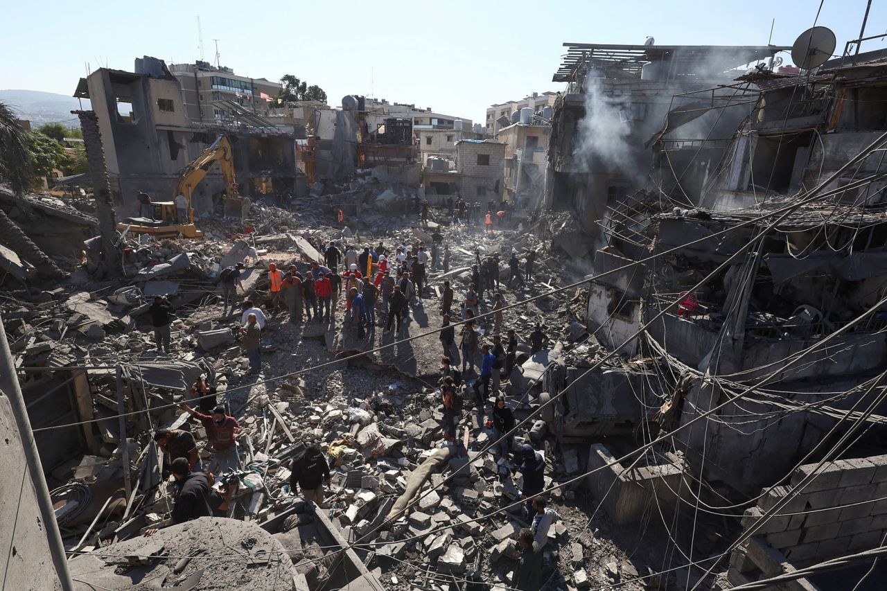 Rescuers search for survivors at the site of an Israeli strike near Rafik Hariri University Hospital, in Beirut, Lebanon, on October 22.