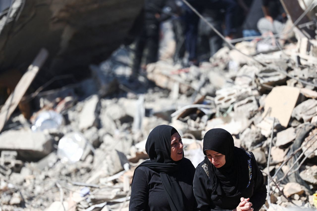 Women react at the site of an Israeli strike near Rafik Hariri University Hospital in Beirut, Lebanon, on October 22.