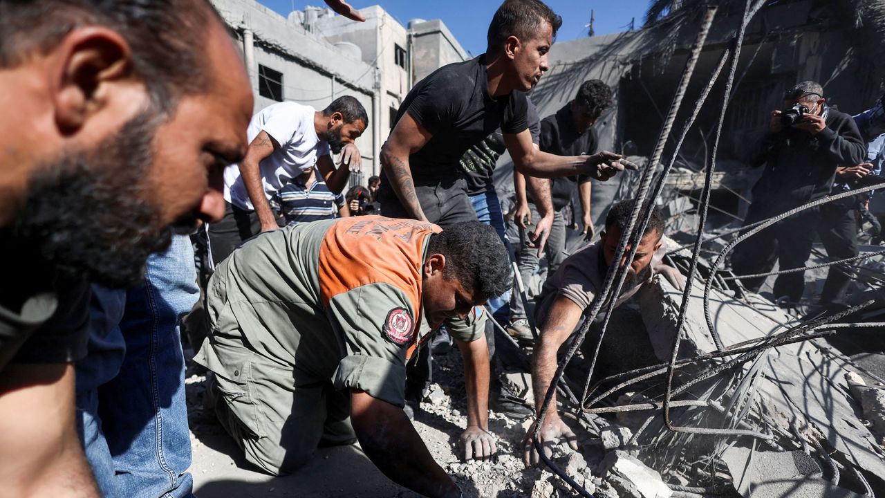 People search through the rubble at the site of an Israeli strike near Rafik Hariri University Hospital in Beirut, Lebanon, on October 22.