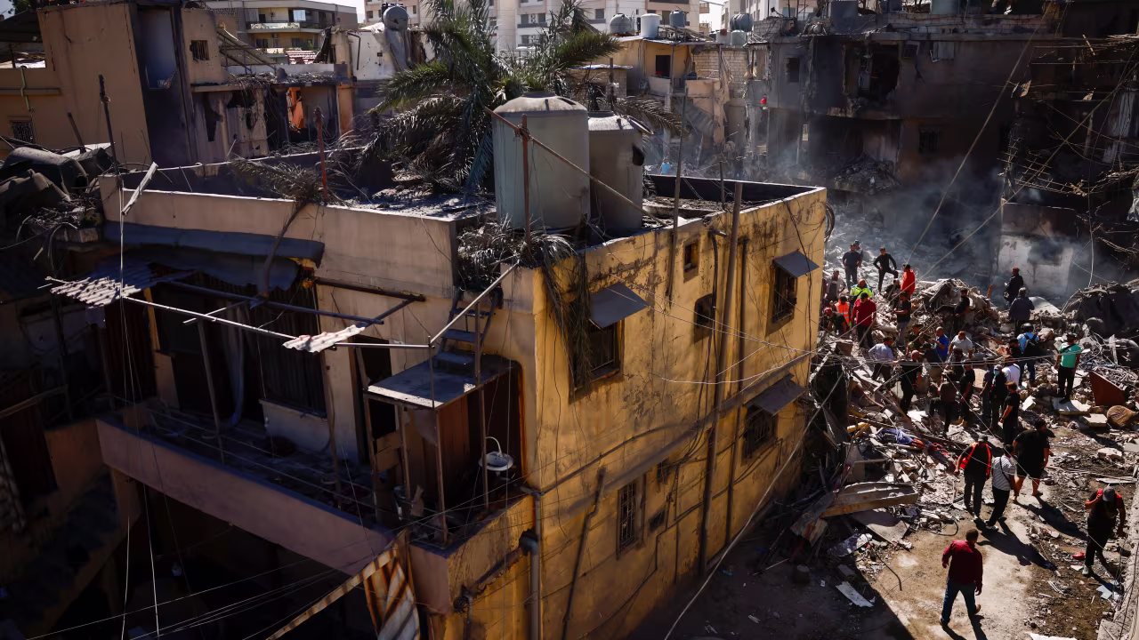 People inspect the site of an Israeli strike in Beirut, Lebanon, on October 22.