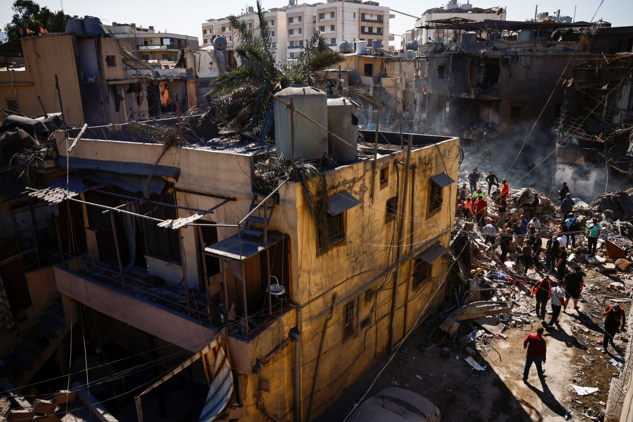 People inspect the site of an Israeli strike in Beirut, Lebanon, on October 22.