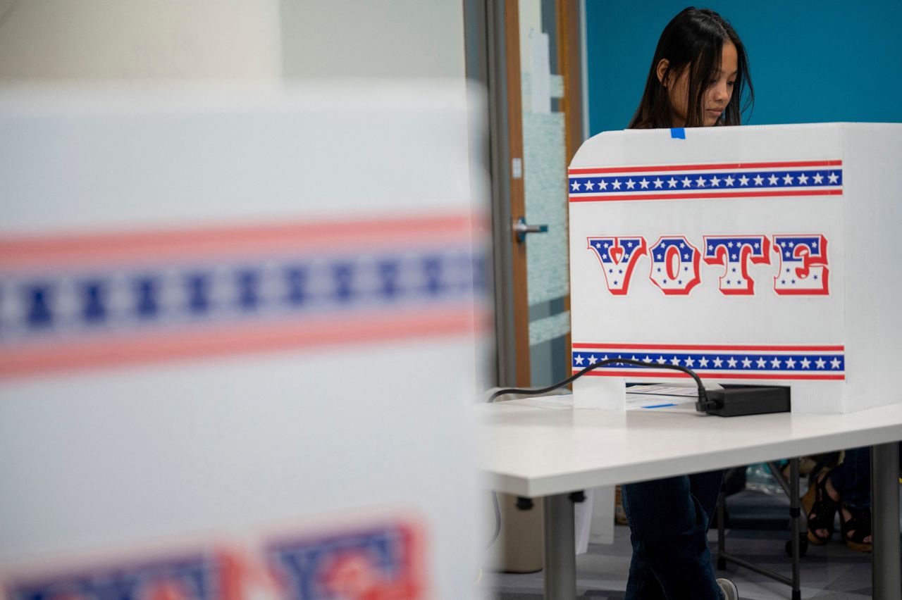 A woman votes on the second day of early voting in Wisconsin at the Milwaukee Area Technical College, on October 23.