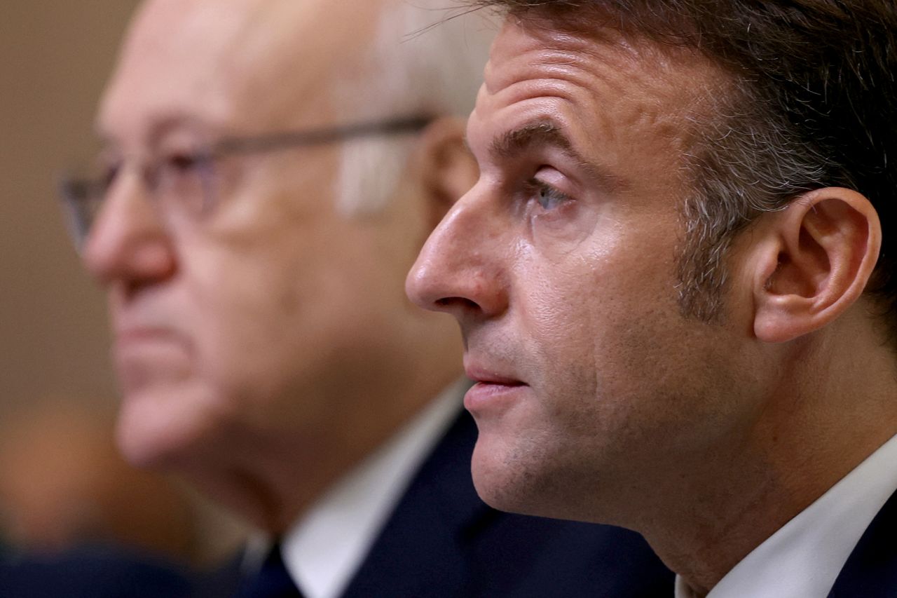 France's President Emmanuel Macron, right, looks on next to Lebanon's Prime Minister Najib Mikati during an international press conference in support of Lebanon in Paris, France, on October 24.