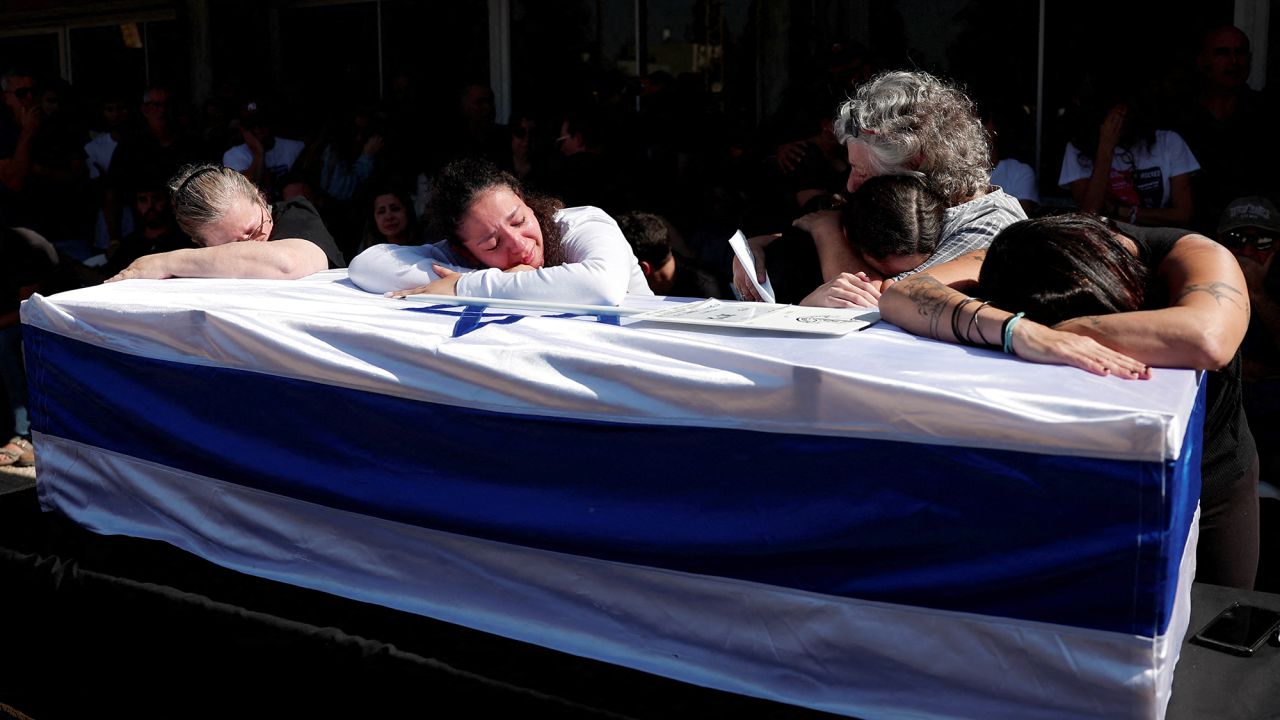 People attend the funeral of Israeli soldier Warrant Officer Guy Idan, who was killed fighting in southern Lebanon, in Shomrat, Israel, on October 25.