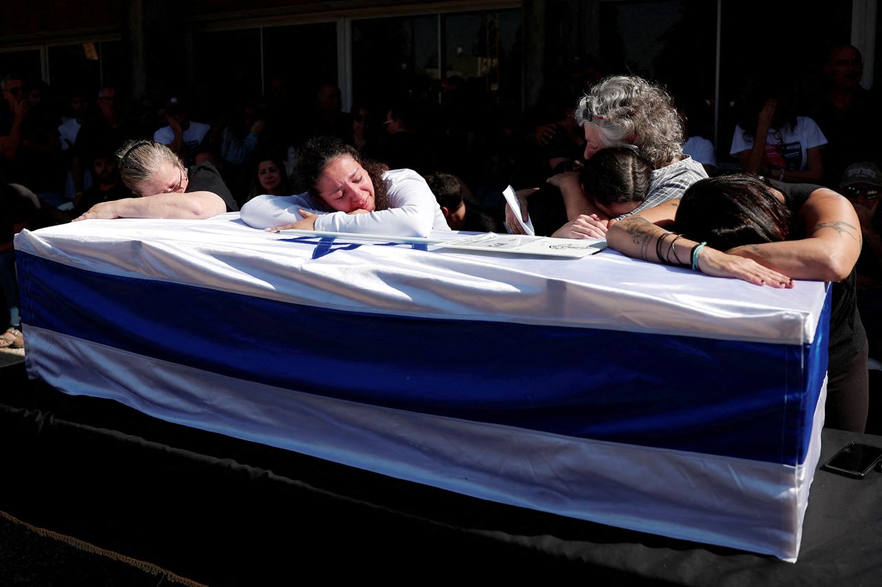 People attend the funeral of Israeli soldier Warrant Officer Guy Idan, who was killed fighting in southern Lebanon, in Shomrat, Israel, on October 25.