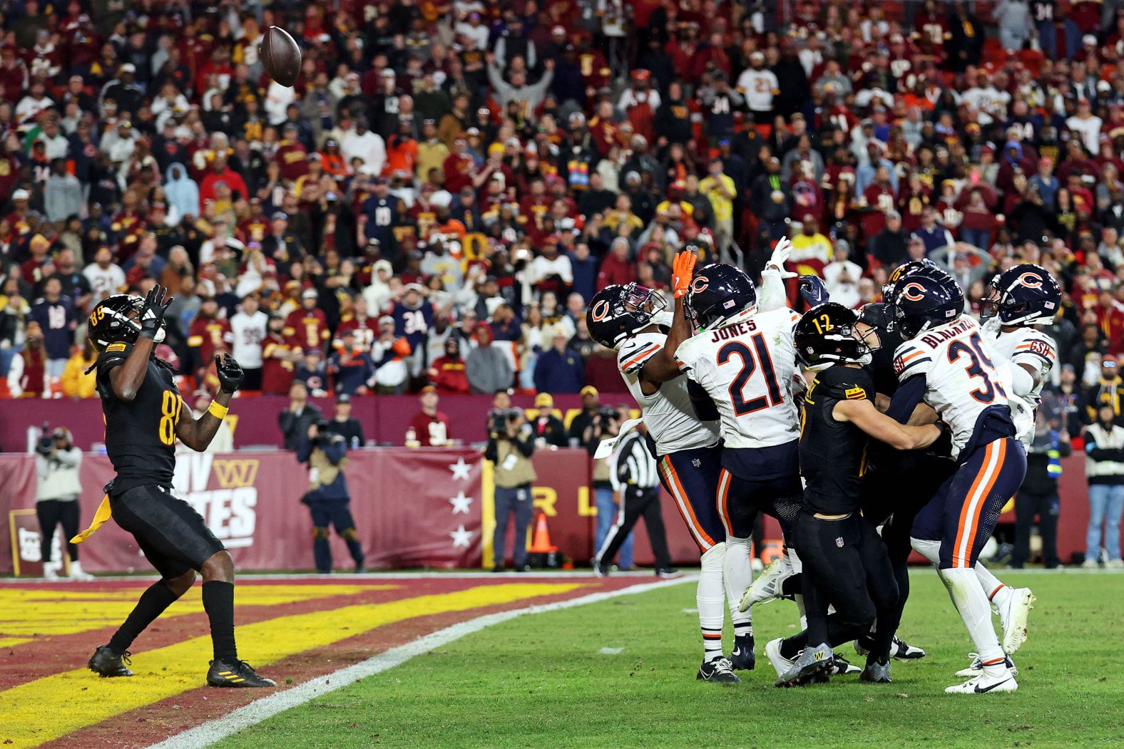 Washington Commanders wide receiver Noah Brown catches a Hail Mary pass that was tipped with no time left to beat the Chicago Bears 18-15 at Commanders Field in Landover, Maryland, on Sunday, October 27.