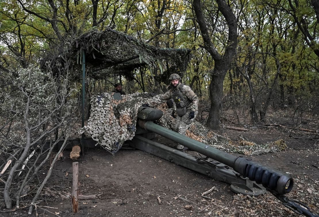 Ukrainian service members from the special police unit Hyzhak (Predator), prepare to fire a howitzer D30 towards Russian troops near the frontline city of Toretsk, Ukraine, on October 25, 2024.