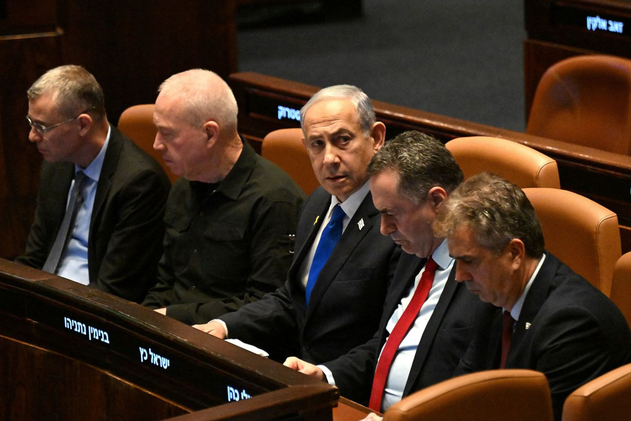 Israeli Prime Minister Benjamin Netanyahu, center, attends the opening of the 25th Knesset session in Jerusalem, on October 28.