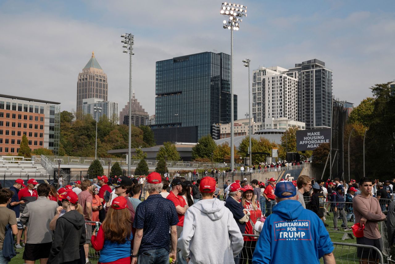 Attendees wait in line ahead of former President Donald Trump's rally in Atlanta on Monday.