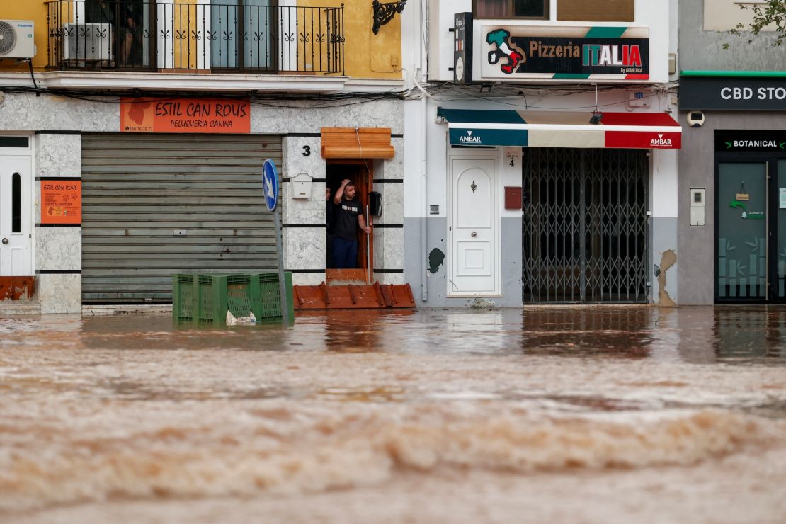 A person reacts to severe flooding on a street in Valencia, Spain, October 29, 2024.